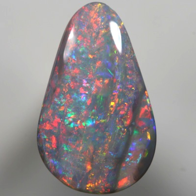 SOLID SEMI BLACK OPAL Sparkling bright red over green, Banded pattern. SEE VIDEO